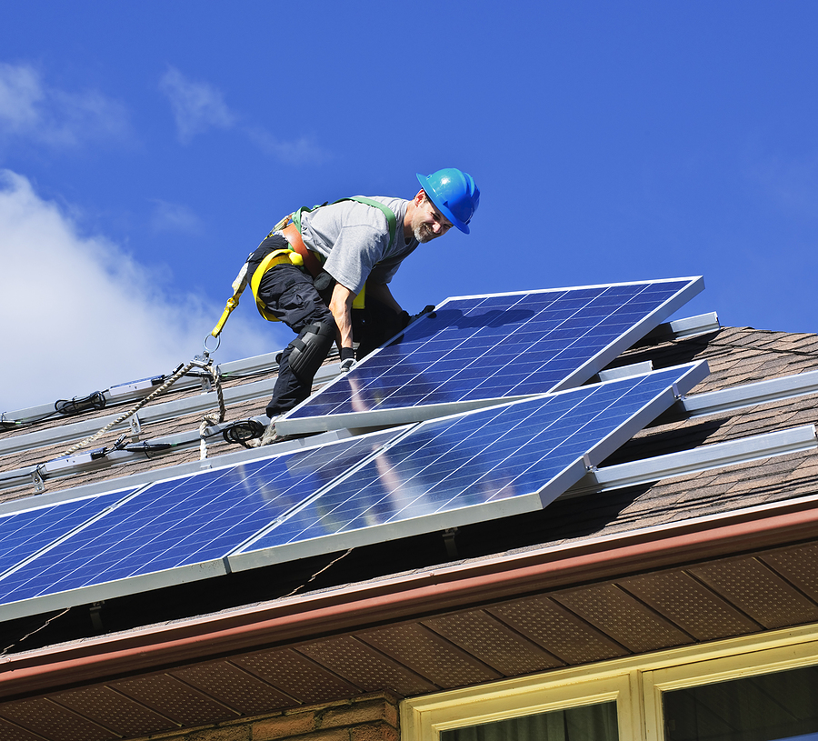 Close up of the side of a home with solar panels