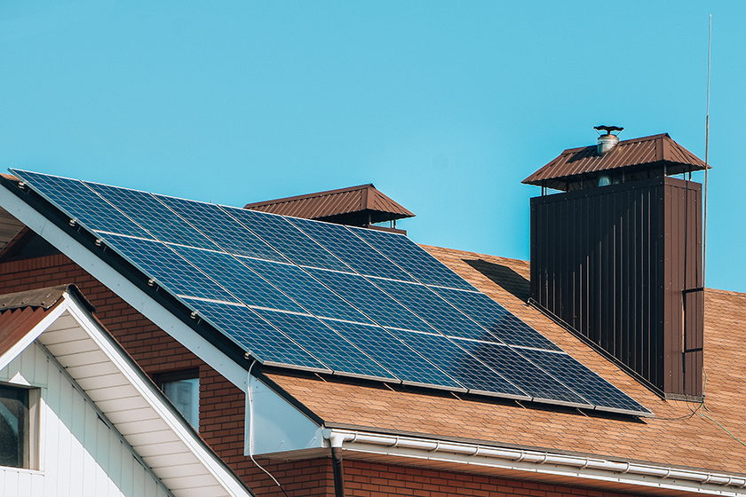 Close up of the side of a home with solar panels