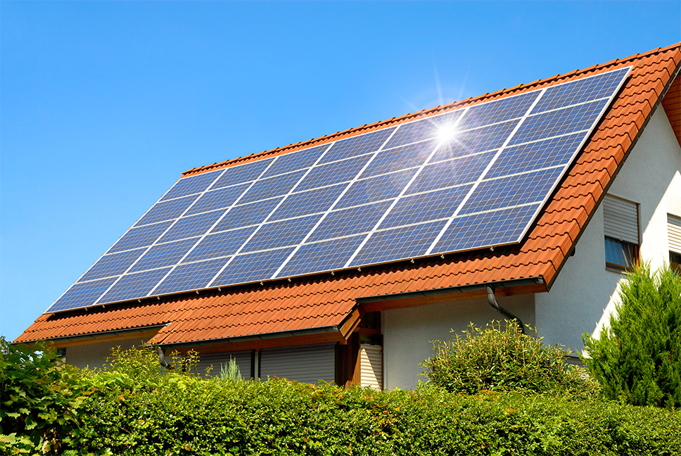 Close up of the side of a home with solar panels